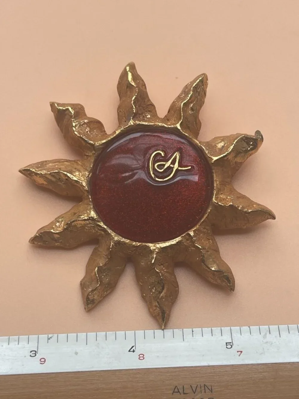 Christian Lacroix Gold-Tone Sun Brooch W/ Red Resin Center & Golden Logo